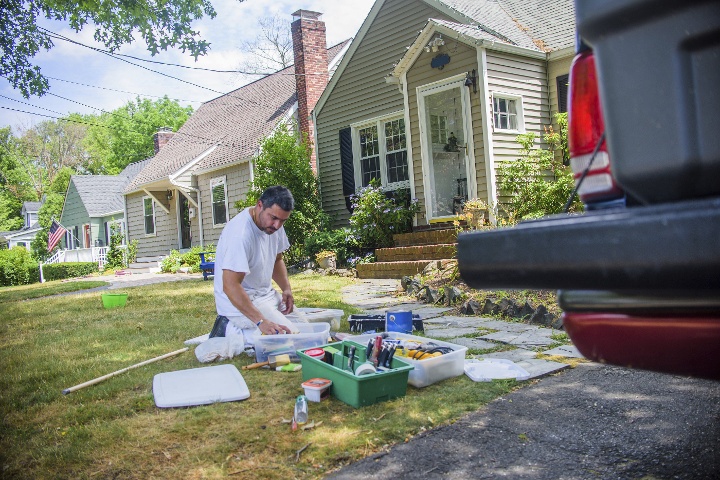 Landlord preparing for some home maintenance in the front yard