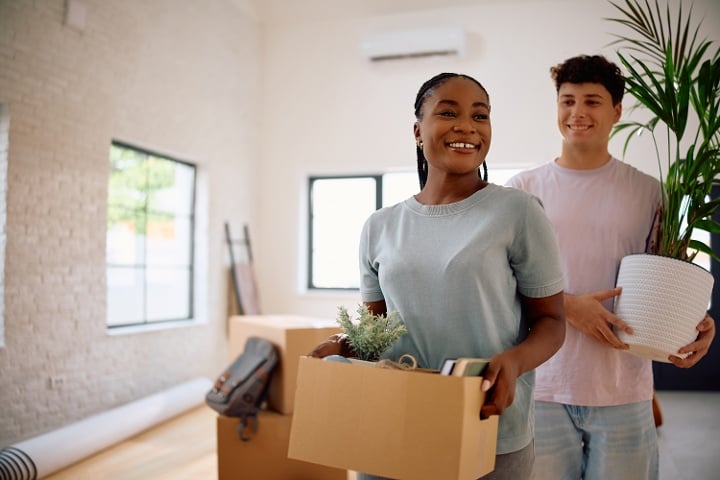 Photo of people moving into a new home